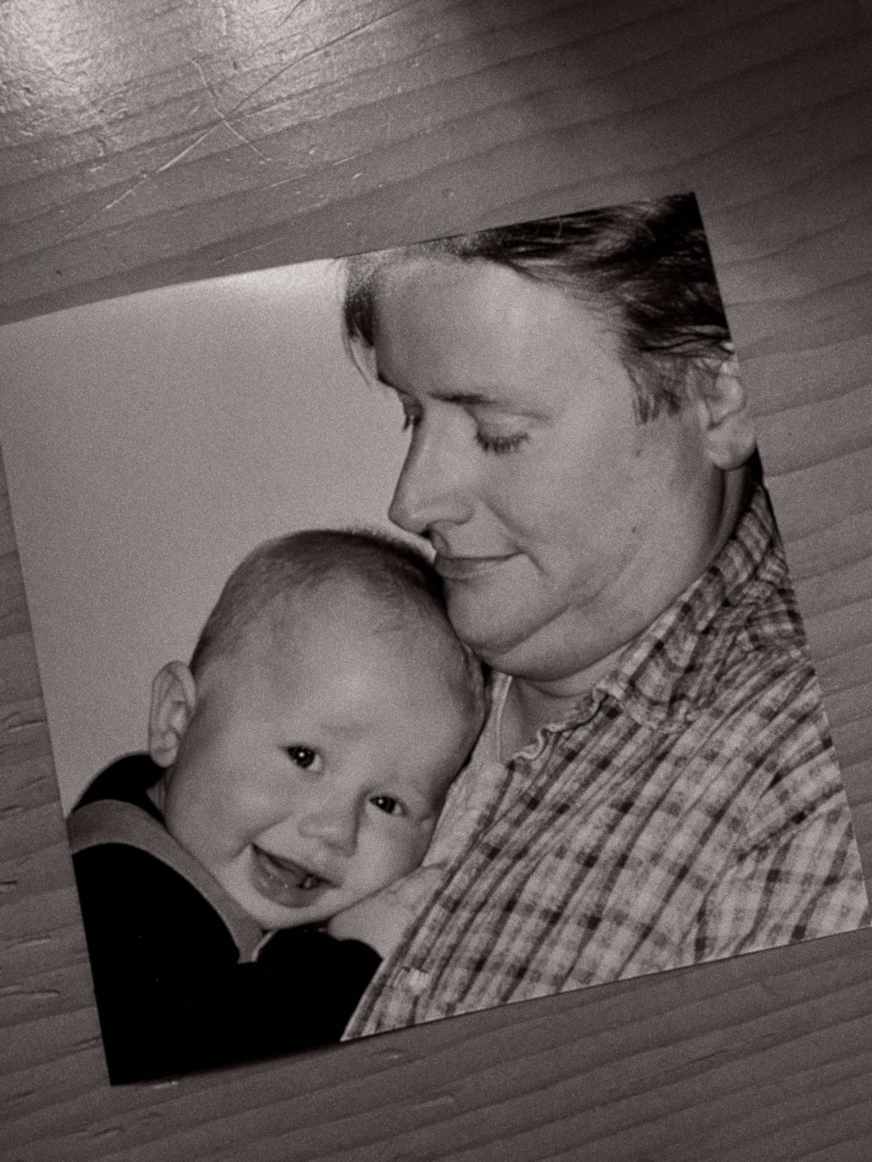Old photograph of Season Twenty-Two founder, Aaron, as a baby being held by his late father, Bill. 